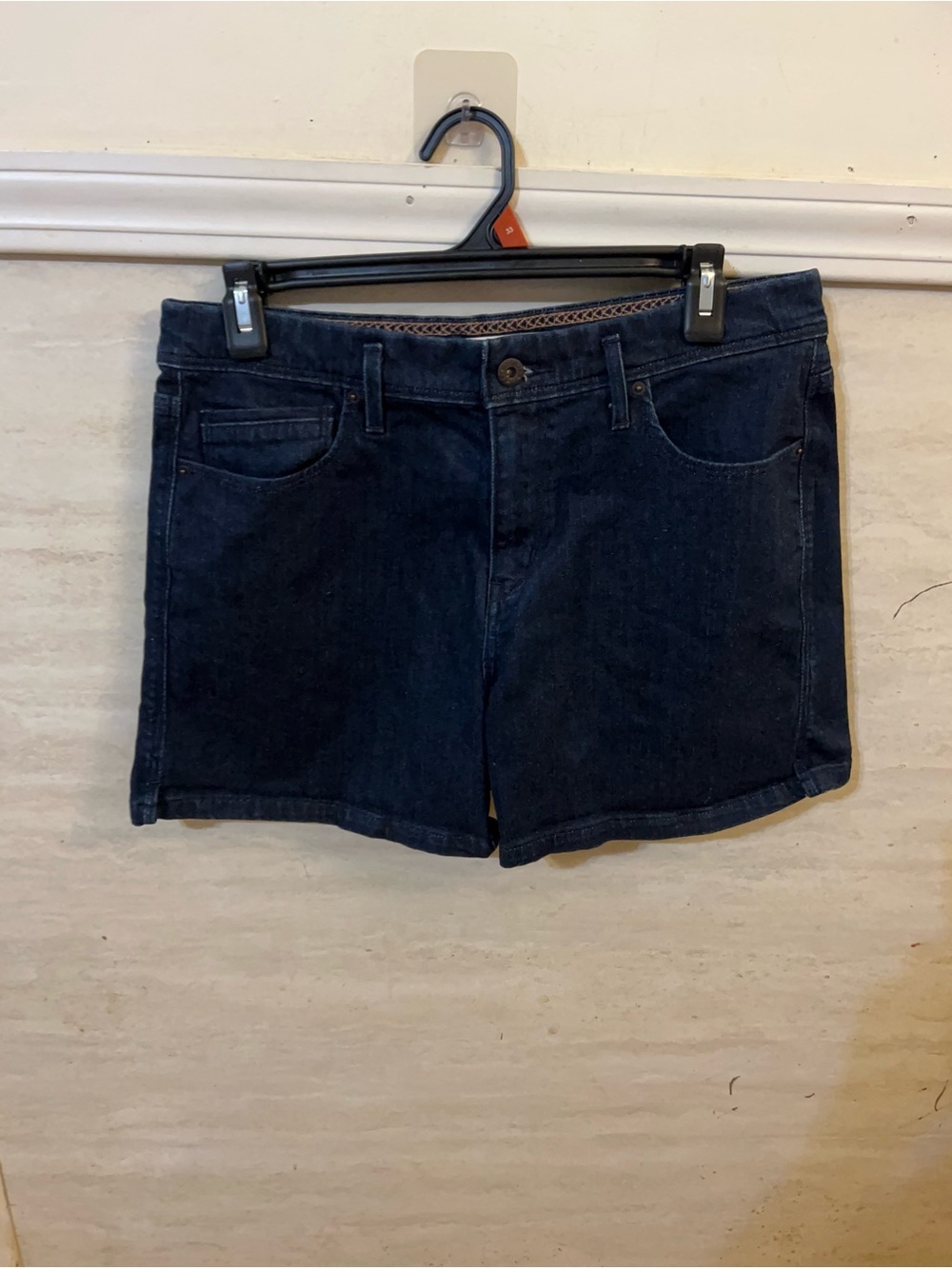 Levi's mid-rise dark wash denim shorts.